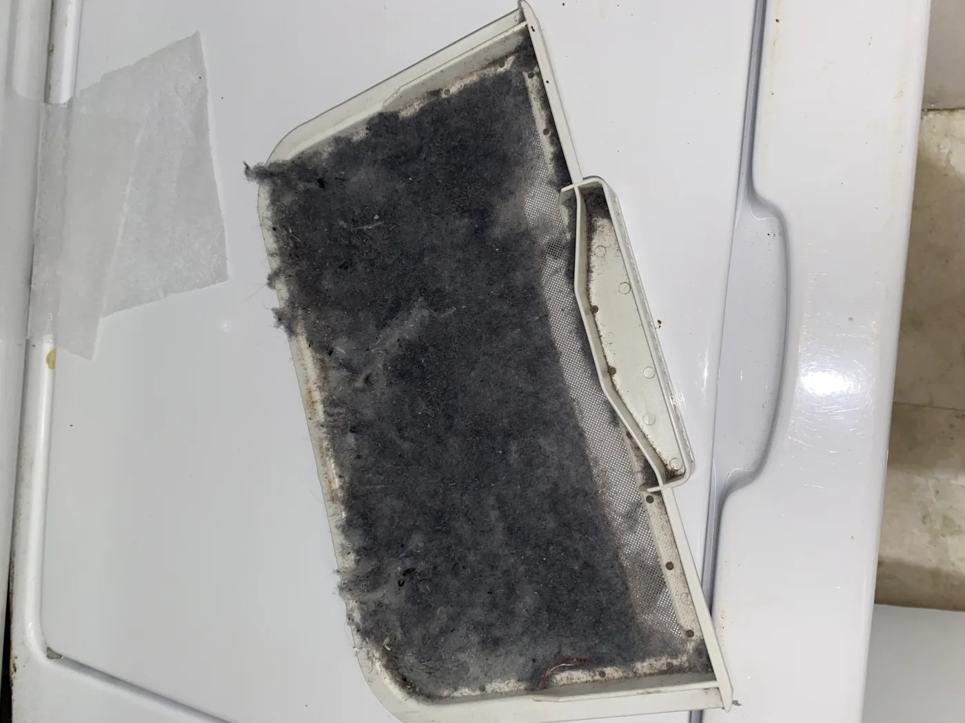 Lint restriction inside dryer vent path before cleaning.